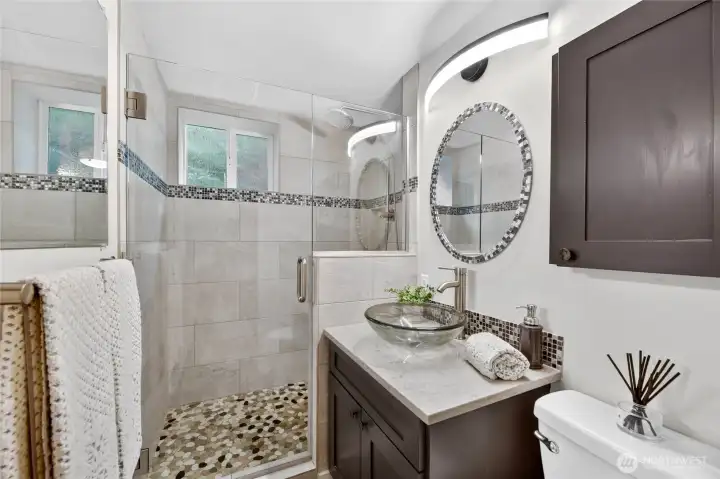 A recently remodeled bathroom rounds out the downstairs area.
