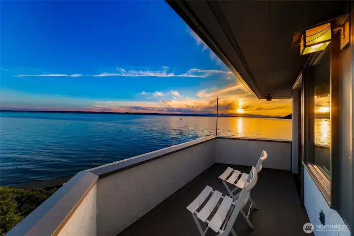 Step onto the private balcony off the primary bedroom and enjoy breathtaking views over the Puget Sound toward Vashon Island and the Olympic Mountains. A prime spot for whale watching, eagles, and daily wildlife.