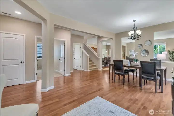 Double Doors Open to the Main-Floor 5th Bedroom with Walk-In Closet; Dining Room to the Right.