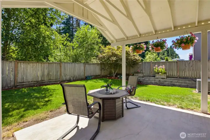 Covered Patio for Year-Round Enjoyment Overlooking the Private Greenbelt.