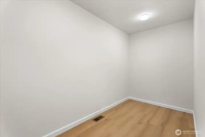 Primary bedroom walk-in closet Primary bedroom walk-in closet