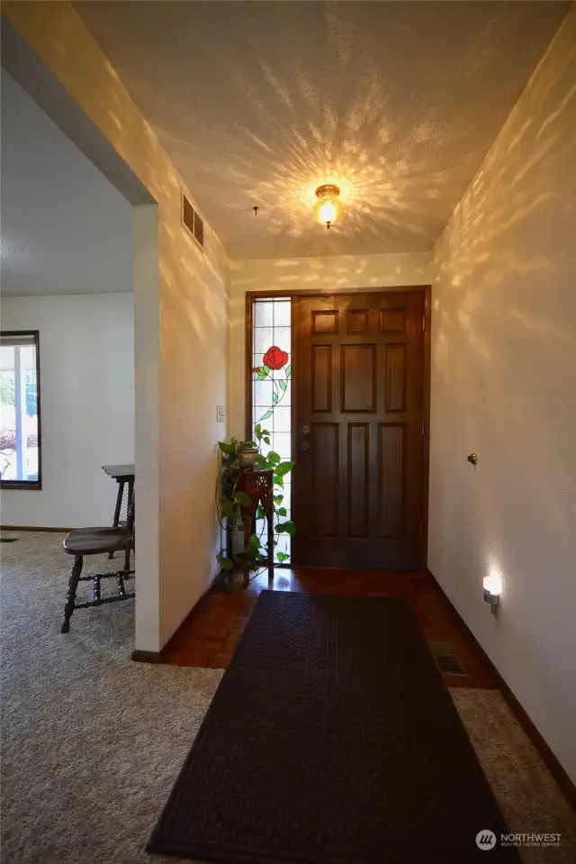 Front door entry next to dining room