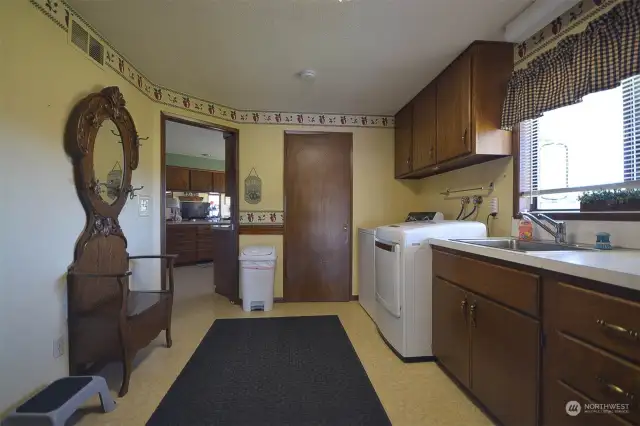 Entering the home through the garage. Breezeway with 3/4 bath and canning kichen