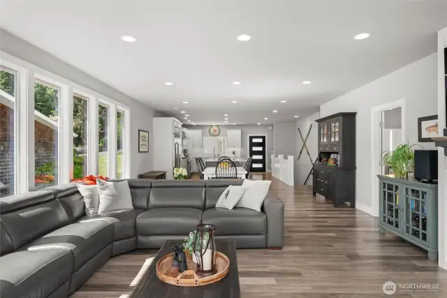 The perfectly sized great room opens to the deck overlooking the yard and lake.