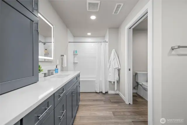 Ample storage in the downstairs bathroom.