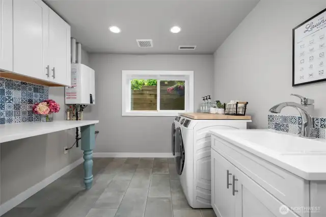 The laundry work room is downstairs.
