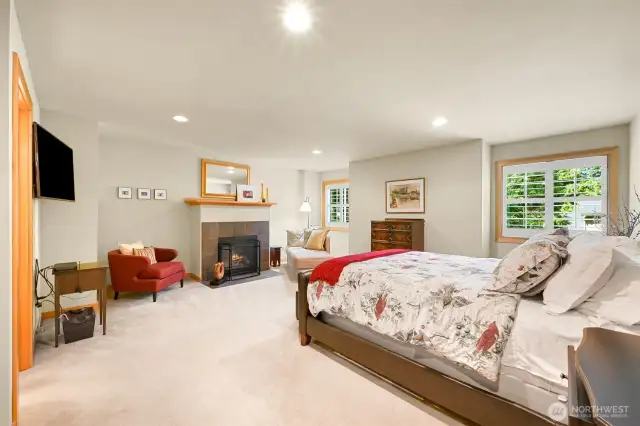 Primary bedroom located upstairs with cozy gas fireplace
