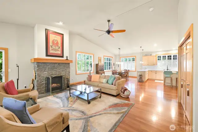 Gas fireplace, vaulted ceiling fan in the living room