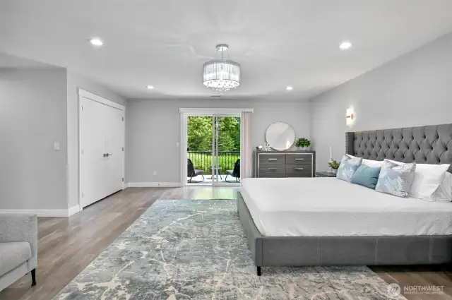 Elegant lighting highlights this room.  A private deck looks out to the back of the property.