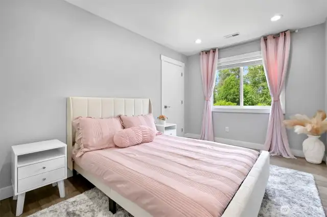 Upstairs bedroom has a walk in closet and looks out to the backyard