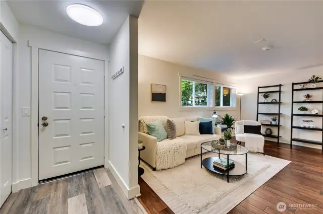 Front entry area with coat closet on the left. Luxury Vinyl Plank flooring is conveniently located where floors may get wet, in the entry hallway and leading into the kitchen.