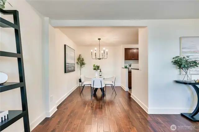 The living room wraps around to the dining room with a beautiful new chandelier that was just installed.