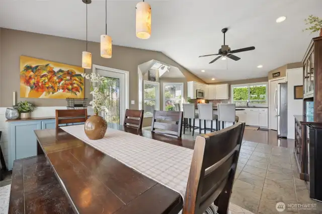 Vaulted ceilings throughout the dining and kitchen space.