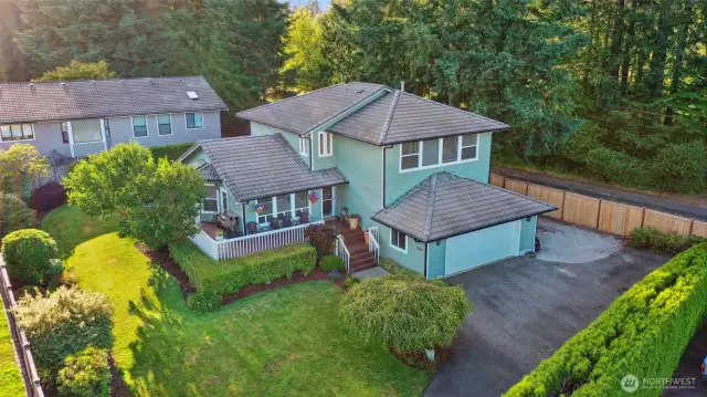 Entrance to home is down a long driveway which adds a ton of privacy. Yard has mature landscaping equipped with a full sprinkler system