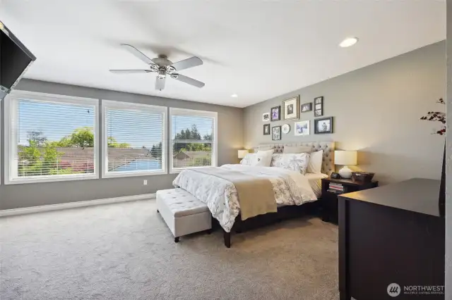 Your primary suite is massive. All new carpet and a wall of windows looking towards East Oly and Mt. Rainier. Imagine waking up to daily sunrises!