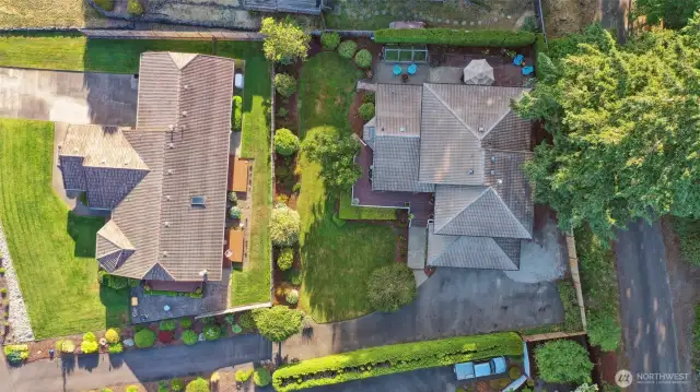 Aerial view showcasing the flag lot. Home has a lifelong tile roof for added peace of mind. Also seen here is gravel pad on the North side of the house that can store extra vehicles, a boat, etc...