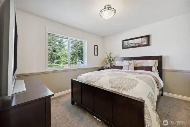 2nd Bedroom. Plenty of room for a queen size bed, nightstand and dresser. Not pictured: Both bedroom closets have custom inserts with drawers. Excellent for storage.