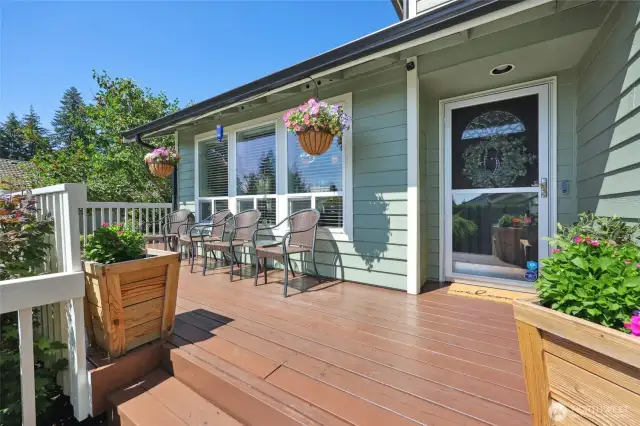 Deck wraps around to another side door off the kitchen.