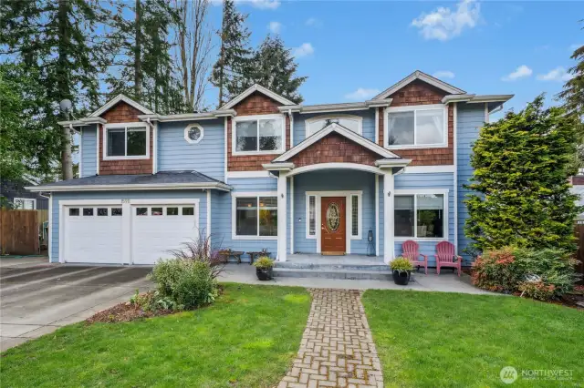 Front of Home from the Street. Two car garage with extra space for parking and ev charging. Photo does not include privacy fence.