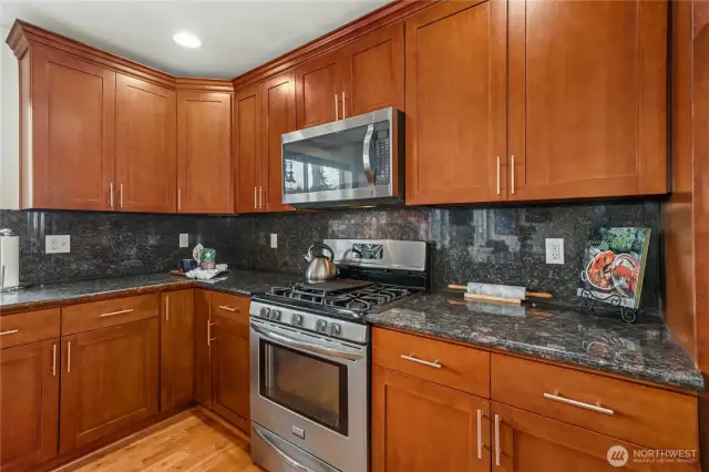 Granite counters and backsplash. Slow close drawers.