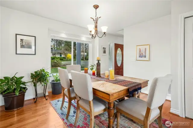 Dining room open to the entry and kitchen