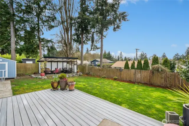 Back deck with back patio and large yard. Sunset views from the backyard