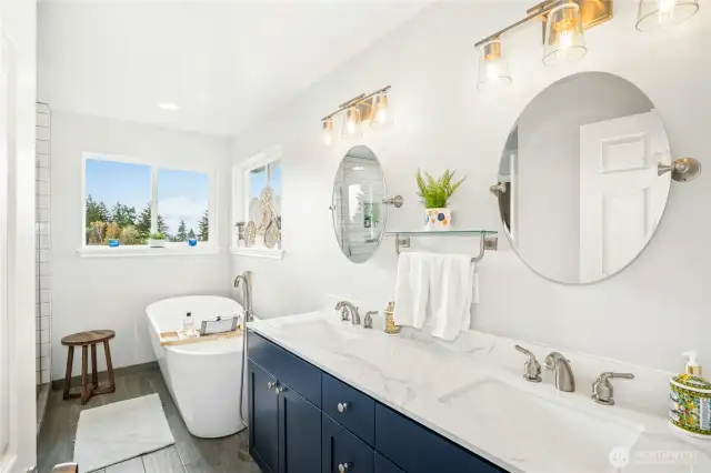 Five piece primary bathroom with soaker tub.