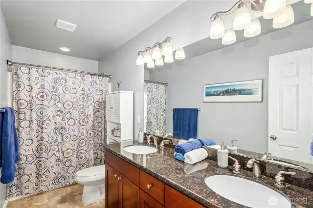Guest bathroom with double vanity.