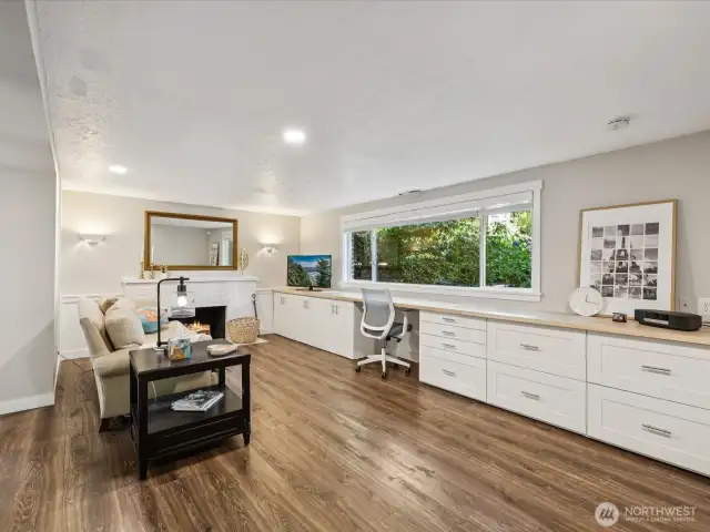 Lower floor rec room w/ 2nd fireplace, & expansive maple top large workspace for office, homework or craft projects