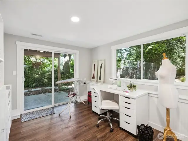 Bedroom #6 offers a private slider exit to lower patio sheltered by main level deck off dining room
