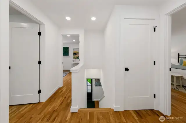 Upper level boasts gorgeous wood floors throughout