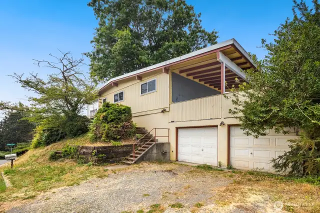 Two-car garage plus driveway parking, and yes, that's a covered patio above it!