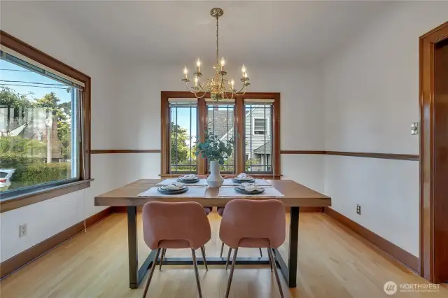 Beautiful dining room with two huge windows letting in tons of natural light!