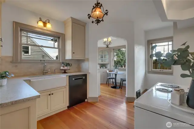 Totally remodeled kitchen with high end custom cabinetry, Shaw farmhouse sink from England, gorgeous granie counters & small travertine subway tile backsplash! Lovely