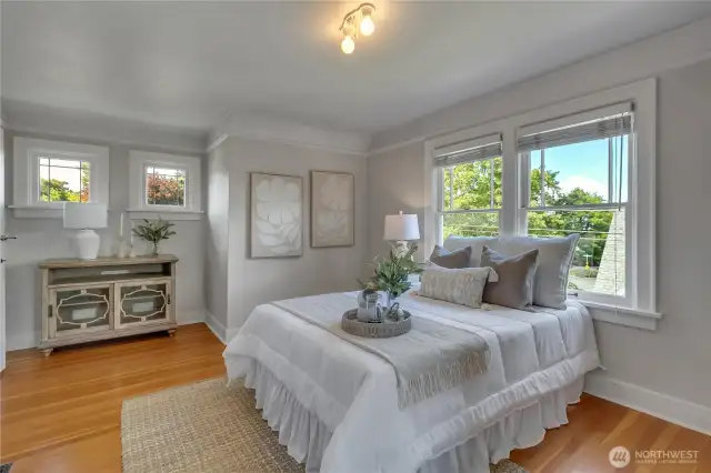 Primary bedroom is spacious! The layout and windows in this entire home are generous and unique!