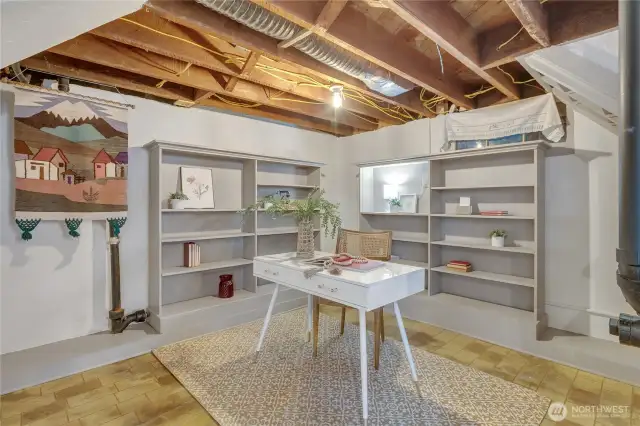 The prior owner had a home office in this semi finished corner of the basement. They left the built-in bookshelves for you!