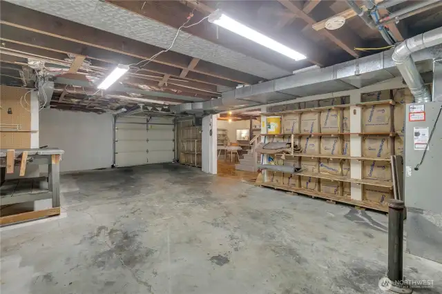 Huge 1 car garage with tons of storage finishes out this basement area.