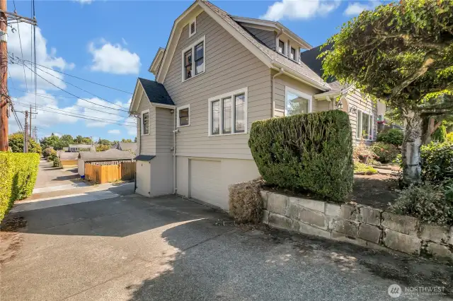 Side alley access to the garage, wood storage, and huge 10' X 30' covered under the deck storage area!