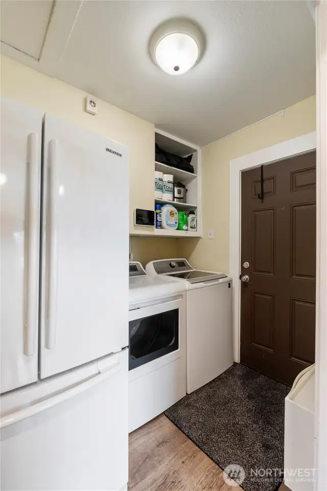 Utility Room with access to side door.