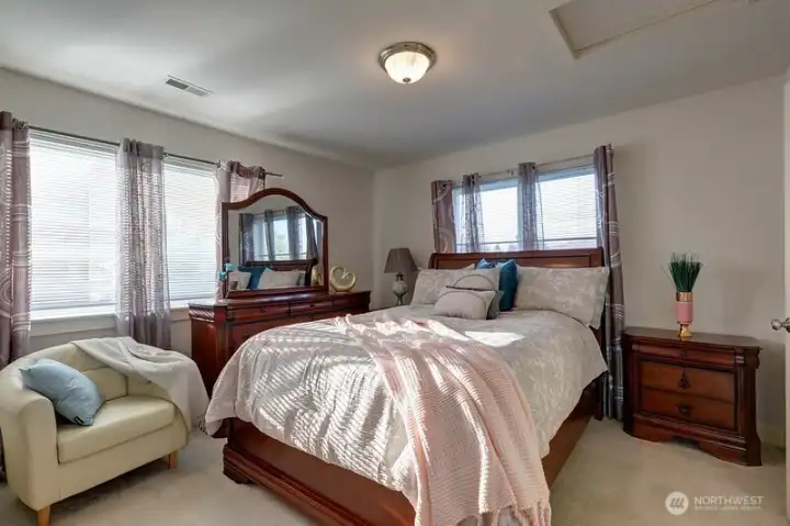 Primary bedroom offers lots of space and great light from windows