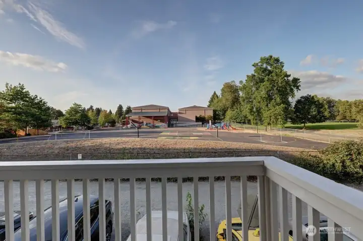 Deck off second level overlooking school playyard