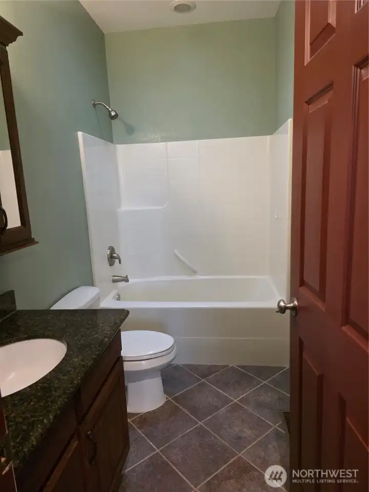 Large shared bath easily accessed from kitchen/living area and from additional bedrooms