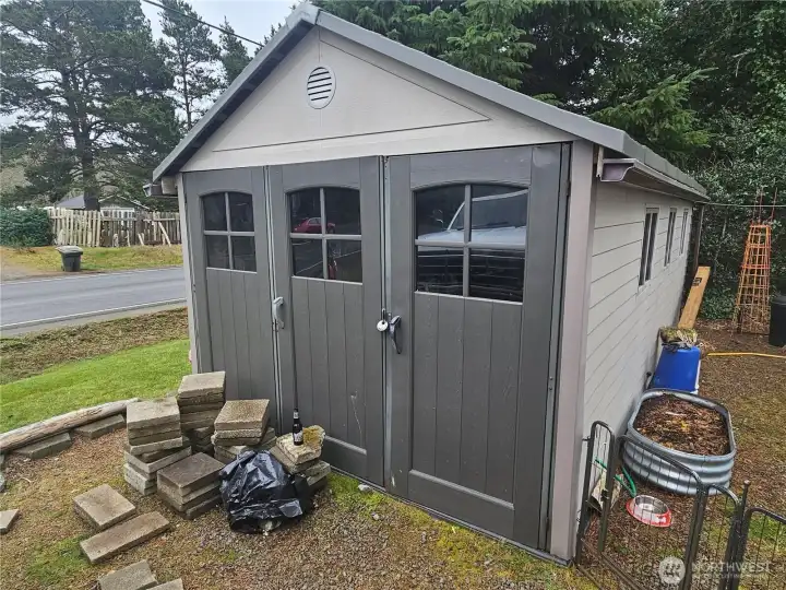 Large shed for all your toys and yard work machines.