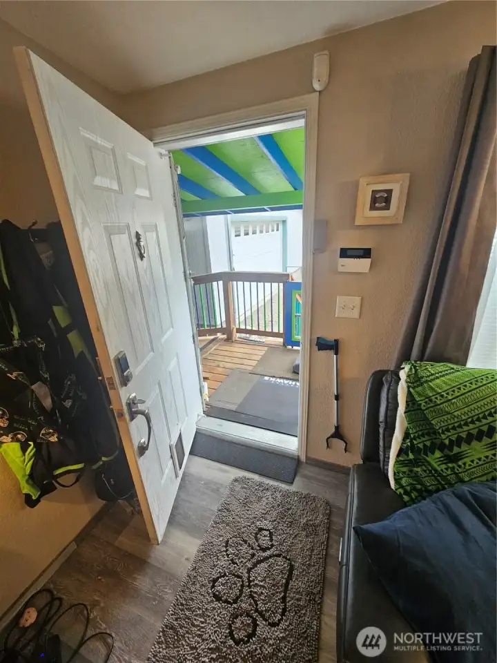 Come on in to the living room from the gated front porch.