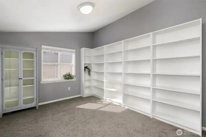 It is a bedroom, doubles as an office work from home space? shelves stay!