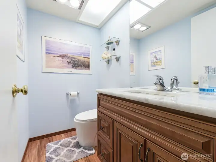 Half bath downstairs. Newer towel sink and Granite counter tops.