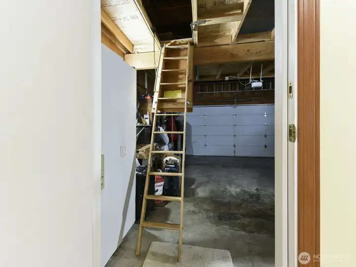 Extra storage upstairs with ladder.