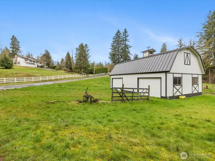 1,200 sq ft barn/shop with large doors, positioned on usable acreage with drive-up access. Could also be a shop, and has power connected.