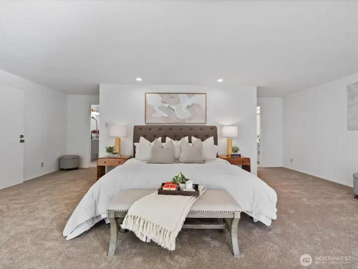 Spacious primary bedroom with room for a full seating arrangement, creating a true retreat feel. Double bathrooms and 3 closets.