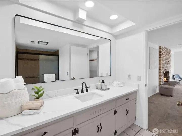 Primary 3/4 bathroom with Quartz countertop and plenty of counter space.